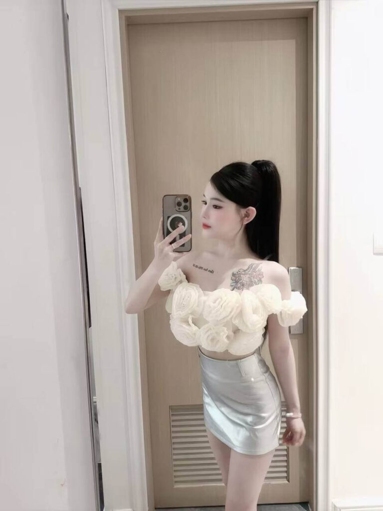 Singapore Hotel Exterior At Night With Bright Entrance